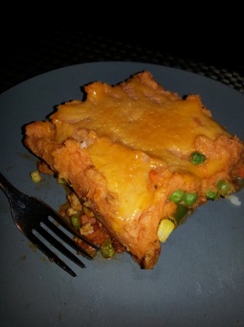Ground turkey and sweet potato sheppards pie with a little bit of cheese on top